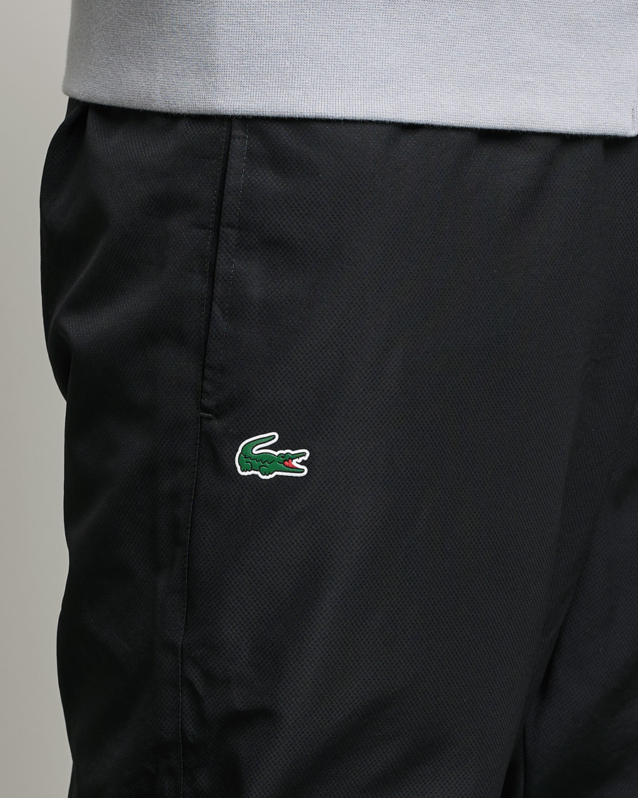 Lacoste guppy track hot sale pants black