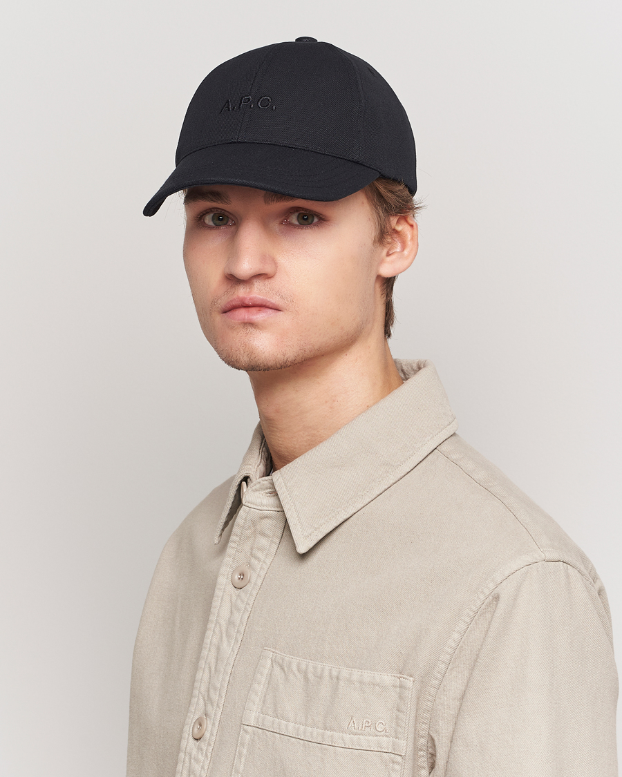 Black peaked cap on sale