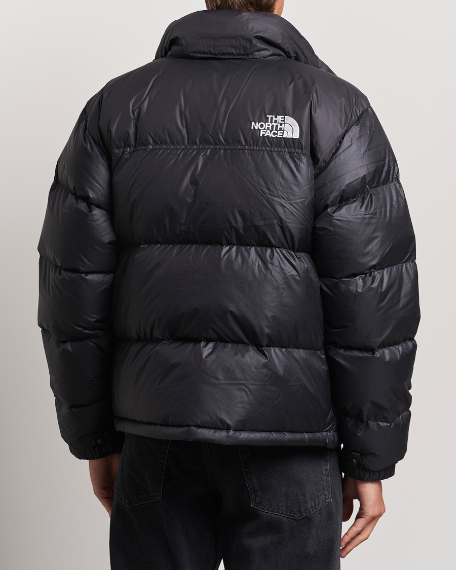 Black the north face puffer jacket online