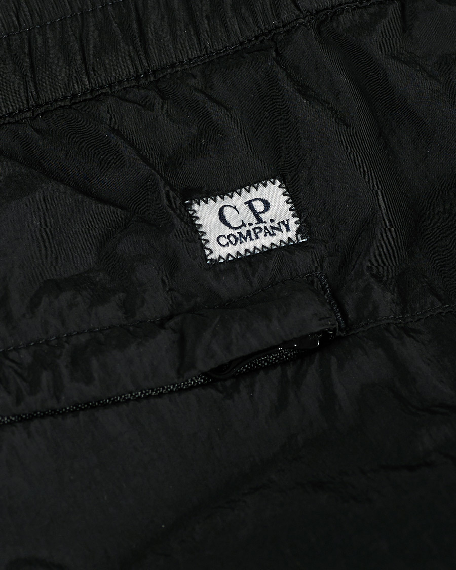 cp company black jeans